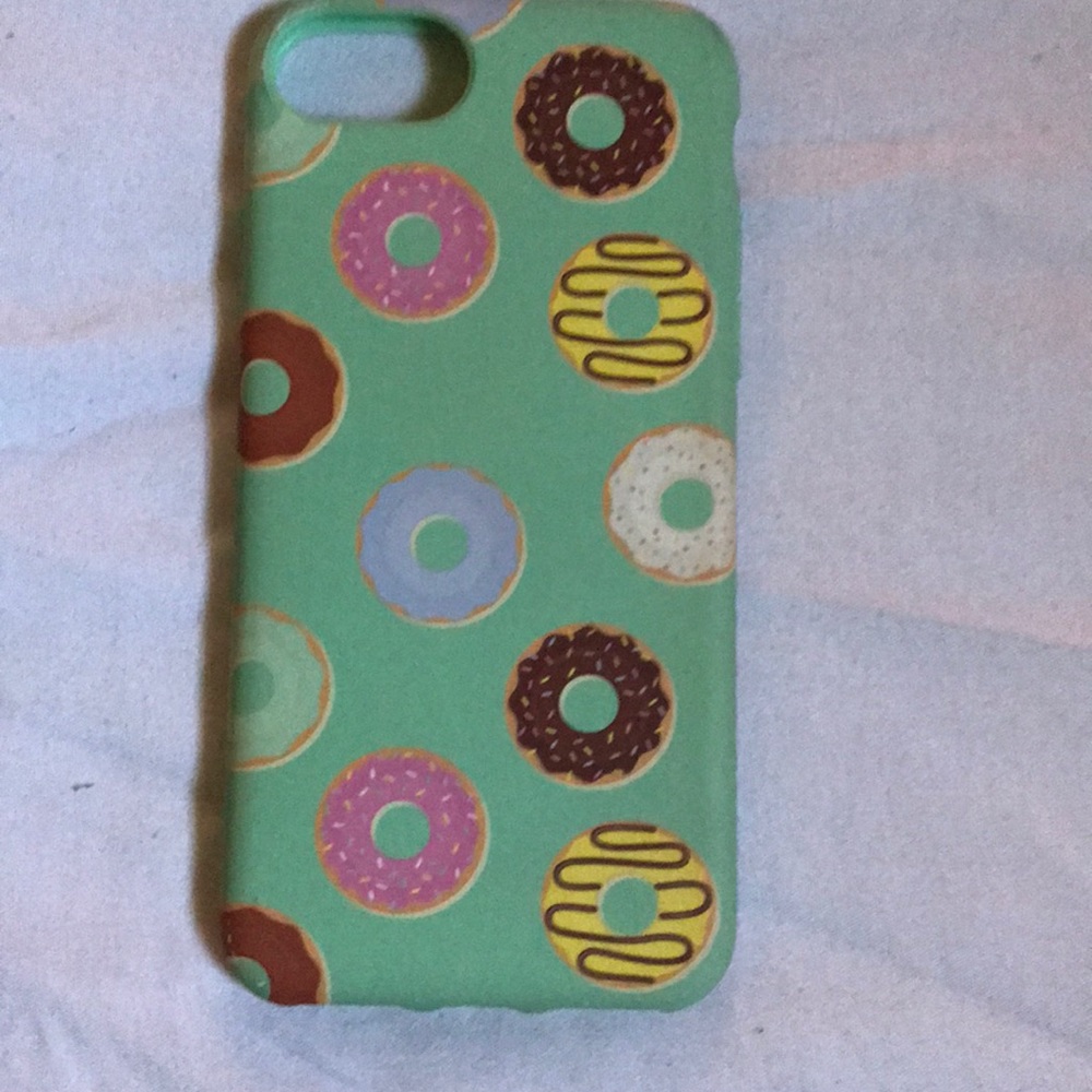 This is an iPhone 7 case with a donut pattern